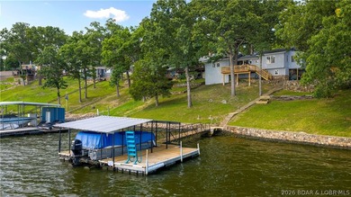There's something familiar about this lake house. Maybe it's the - photo 1