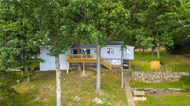There's something familiar about this lake house. Maybe it's the - photo 2