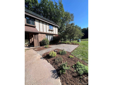 Nestled in one of Marquette's most desirable neighborhoods, this - photo 2