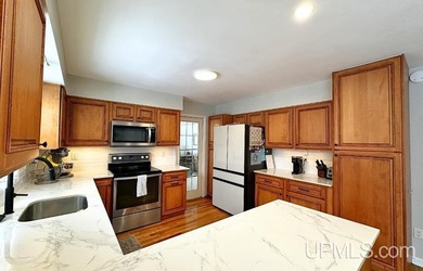 Nestled in one of Marquette's most desirable neighborhoods, this - photo 9