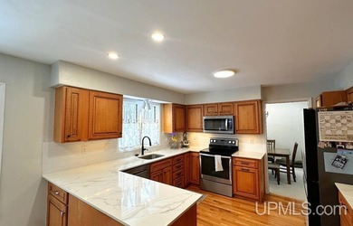 Nestled in one of Marquette's most desirable neighborhoods, this - photo 10