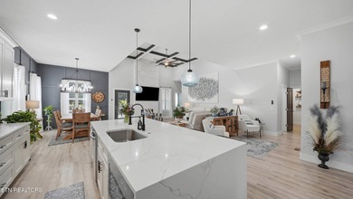 Welcome home to this beautifully designed five bedroom, two and - photo 12