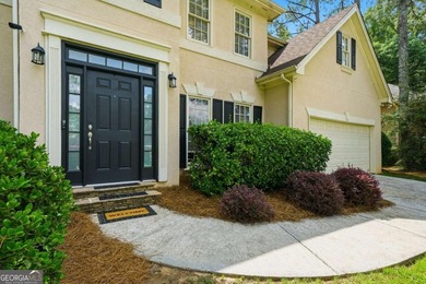 Nestled in the highly sought-after Waters Edge, this traditional - photo 2