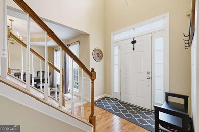 Nestled in the highly sought-after Waters Edge, this traditional - photo 3