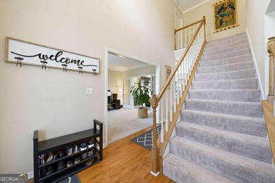 Nestled in the highly sought-after Waters Edge, this traditional - photo 4