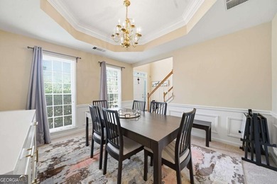 Nestled in the highly sought-after Waters Edge, this traditional - photo 6