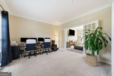 Nestled in the highly sought-after Waters Edge, this traditional - photo 8