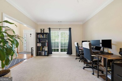 Nestled in the highly sought-after Waters Edge, this traditional - photo 9