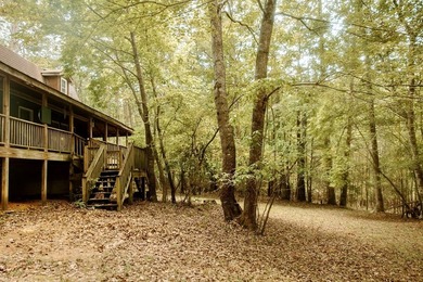 Surrounded by nature, this charming 3-bedroom, 2-bath waterfront - photo 26