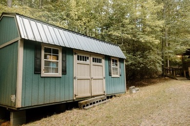 Surrounded by nature, this charming 3-bedroom, 2-bath waterfront - photo 31