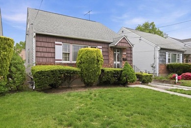 Cape Cod style detached home with 3/4 bedrooms and 1 full bath - photo 1
