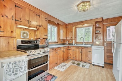 Tucked into the hillside, this awesome lakefront home offers so - photo 15