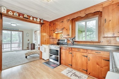 Tucked into the hillside, this awesome lakefront home offers so - photo 17