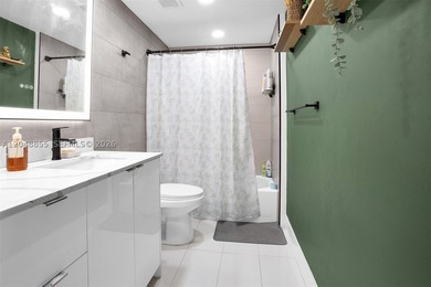 Welcome to this bright and inviting 2-bedroom, 1-bathroom condo - photo 17