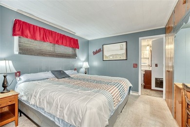 Tucked into the hillside, this awesome lakefront home offers so - photo 18