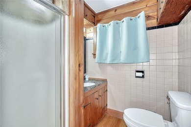 Tucked into the hillside, this awesome lakefront home offers so - photo 25