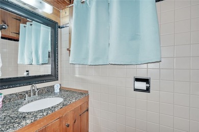 Tucked into the hillside, this awesome lakefront home offers so - photo 26