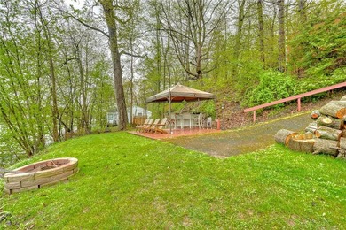 Tucked into the hillside, this awesome lakefront home offers so - photo 42
