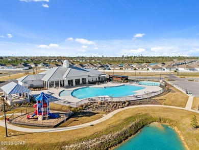 PRICE REDUCTION! Experience peaceful pondfront living in this - photo 2