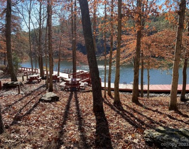 Welcome to Hidden Lake! This gated log home community is located - photo 8
