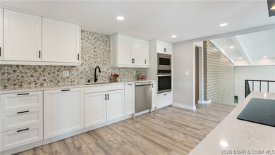 This rare lakefront villa-esque condo is one of only 2 units in - photo 7