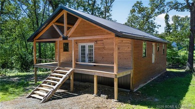 This 3 bed 2 bath Truman Lake home presents you with an amazing - photo 3