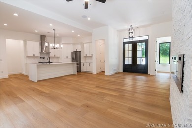 NEW CONSTRUCTION in Porto Cima! This modern ranch delivers the - photo 2