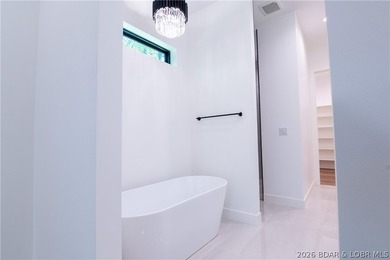NEW CONSTRUCTION in Porto Cima! This modern ranch delivers the - photo 5