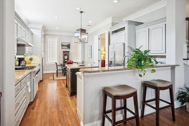 Welcome to refined, lock-and-leave luxury in this stunning