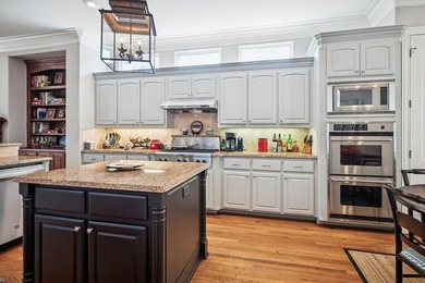 Welcome to refined, lock-and-leave luxury in this stunning