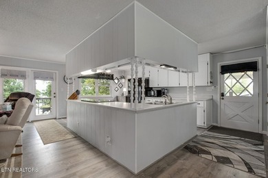 BRAND NEW ROOF! This waterfront family home has been in the - photo 12