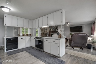BRAND NEW ROOF! This waterfront family home has been in the - photo 16