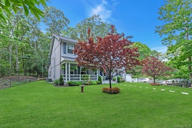 Tucked away on a beautifully landscaped property, this 2022 - photo 3