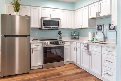 Welcome to The Cove, unit B104 complete with many upgrades and - photo 3
