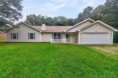 Escape to Lake of the Ozarks in this peaceful country setting - photo 1