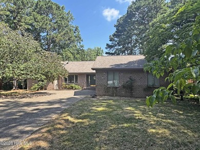 Enjoy peaceful waterfront living in this full-brick, 3-bedroom - photo 1