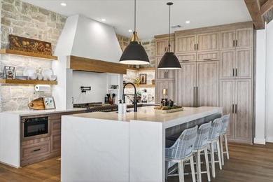 Experience refined lake living in this exceptional - photo 8