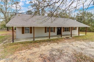 Situated on 1.5 acres in the peaceful Gulfport countryside, this - photo 1