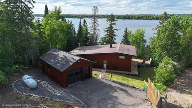 This 4BR, 2BA Rainy Lake property offers 100' of accessible - photo 1