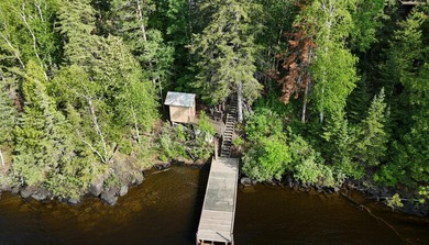 This 4BR, 2BA Rainy Lake property offers 100' of accessible - photo 2