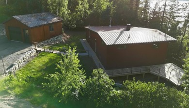This 4BR, 2BA Rainy Lake property offers 100' of accessible - photo 6