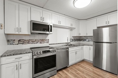 Rare opportunity to own a stunning 4th-floor corner unit in the - photo 47