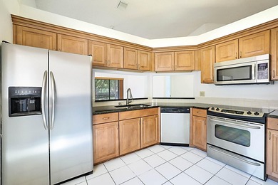 This 3-bedroom, 2-bath townhome with a 1-car garage is located - photo 2