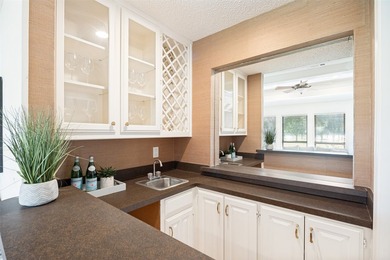 Nestled on a picturesque golf course lot in Richardson, this - photo 5