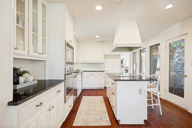 Nestled on a picturesque golf course lot in Richardson, this - photo 7