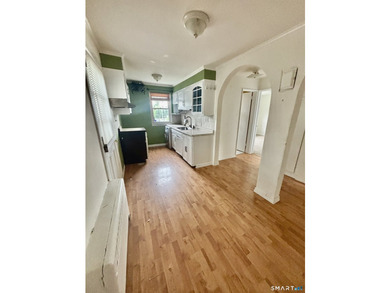 Opportunity knocks! This upper-level end-unit condo in Stamford - photo 13