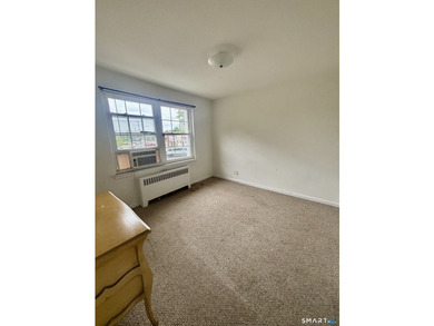 Opportunity knocks! This upper-level end-unit condo in Stamford - photo 15