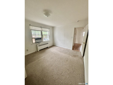 Opportunity knocks! This upper-level end-unit condo in Stamford - photo 16