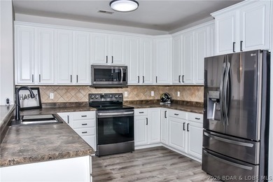 Experience lakefront living at its finest in this walk-out - photo 6