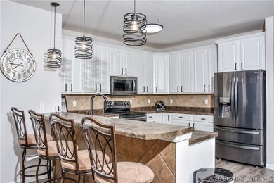 Experience lakefront living at its finest in this walk-out - photo 8